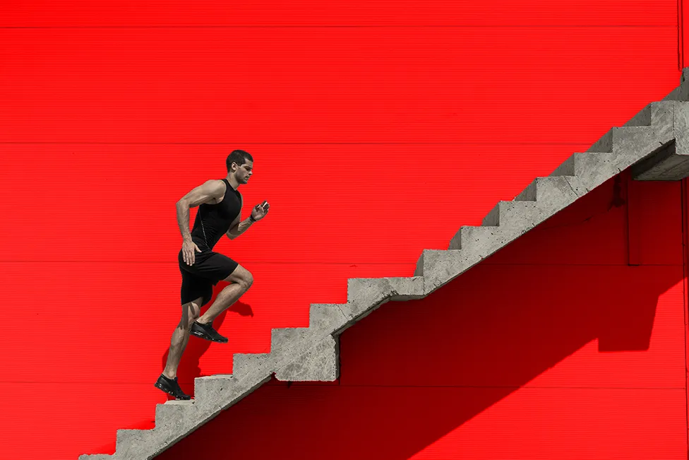 Man running up stairs